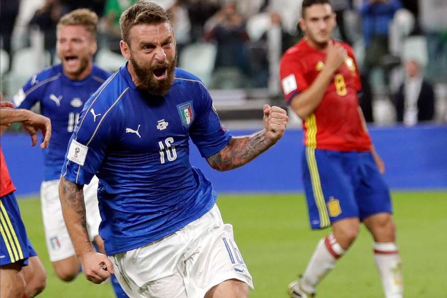 Italy's De Rossi celebrates after scoring against Spain in their World Cup qualifier in 2016.