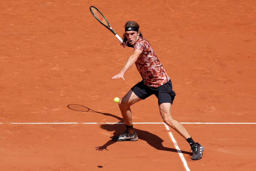 Tsitsipas returns the ball against Vesely