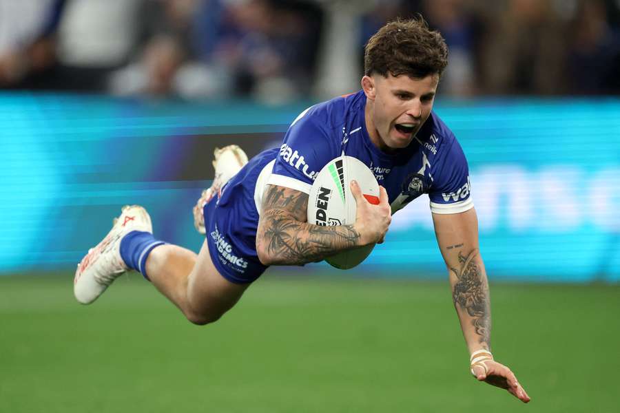 Canterbury Bulldogs halfback Toby Sexton scores the first of the Bulldogs' three tries against Melbourne.