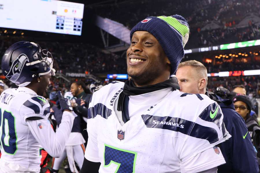 Seahawks quarterback Geno Smith smiling after a win against the Chicago Bears (2024)
