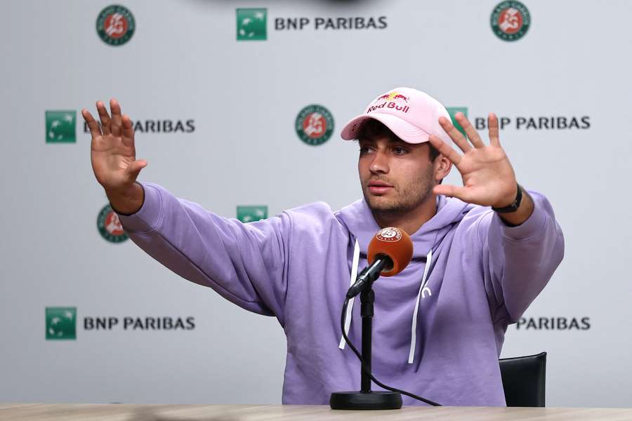 Flavio Cobolli speaks during a press conference after advancing to the final following the retirement of Matteo Arnaldi