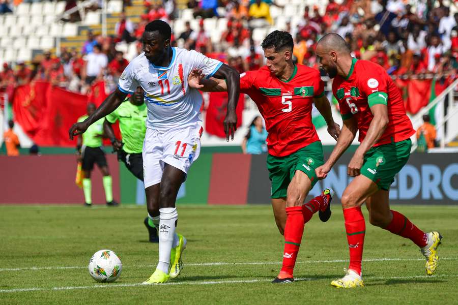 Silas (L) fights for the ball with Morocco defenders Nayef Aguerd (C) and Romain Saiss
