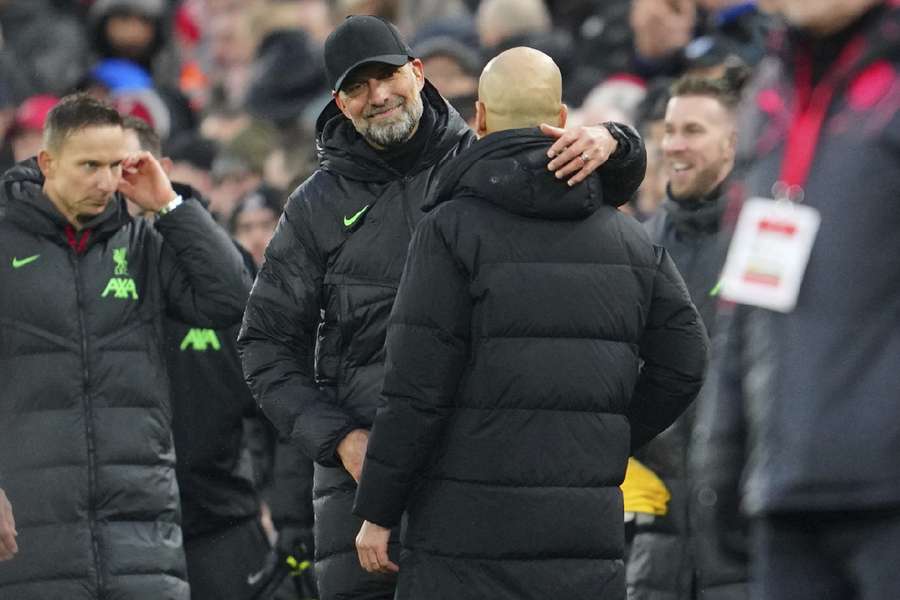 Klopp and Pep embrace after the game