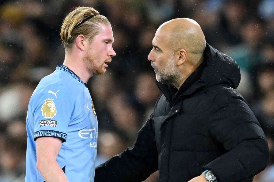 Man City's Kevin De Bruyne speaks to Pep Guardiola during their match against Nottingham Forest on Wednesday