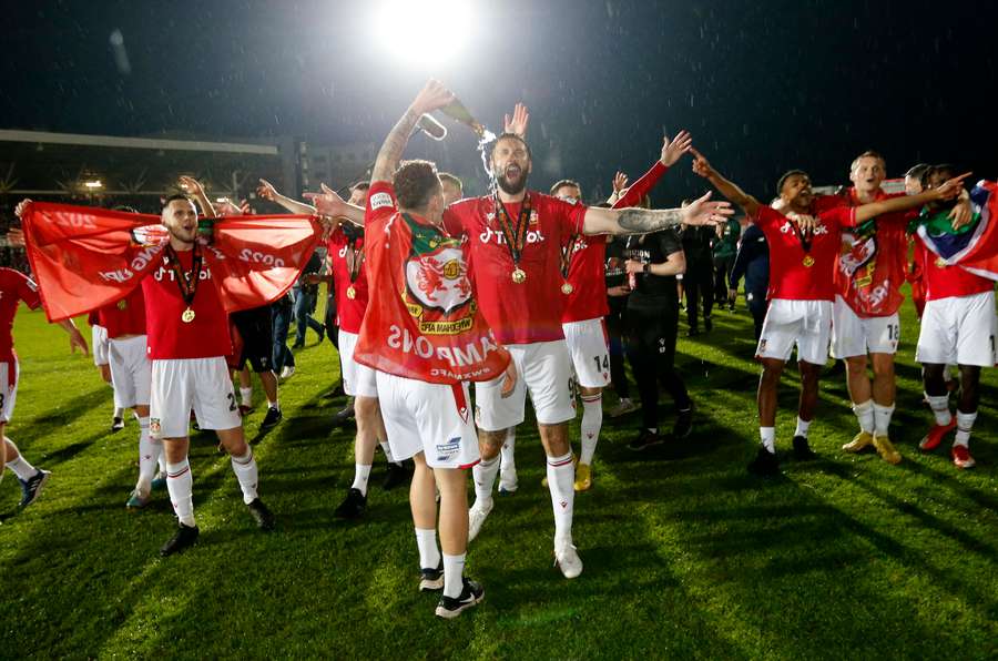 Wrexham celebrate their National League title at the Racecourse Ground