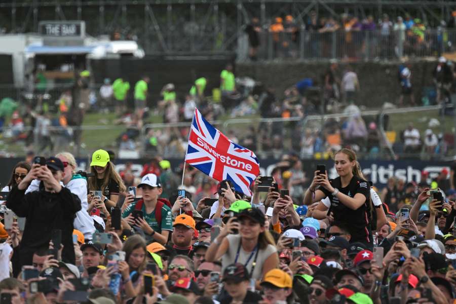 Formula 1 fans watch the podium ceremony for the British Grand Prix at Silverstone