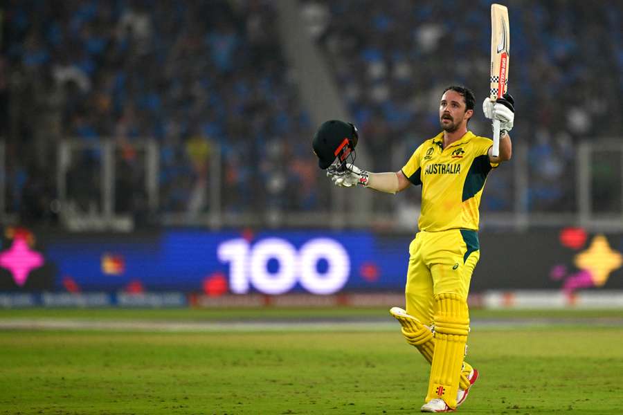 Travis Head celebrates after scoring a century against India