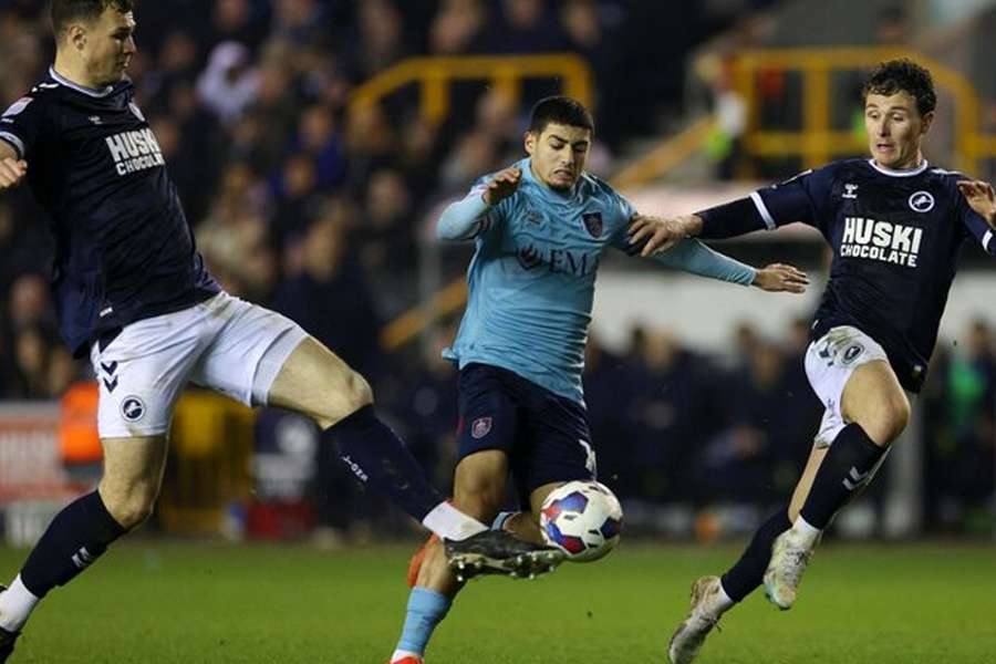 Millwall rescued a draw against league leaders Burnley