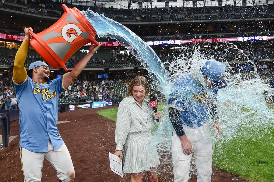 Milwaukee Brewers designated hitter Jake Bauers is dunked by shortstop Willy Adames after beating the Arizona Diamondbacks