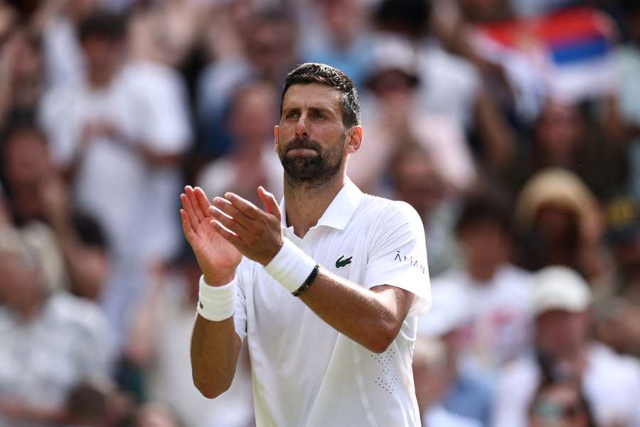 Novak Djokovic celebrates after winning his fourth-round match against Russia's Roman Safiullin