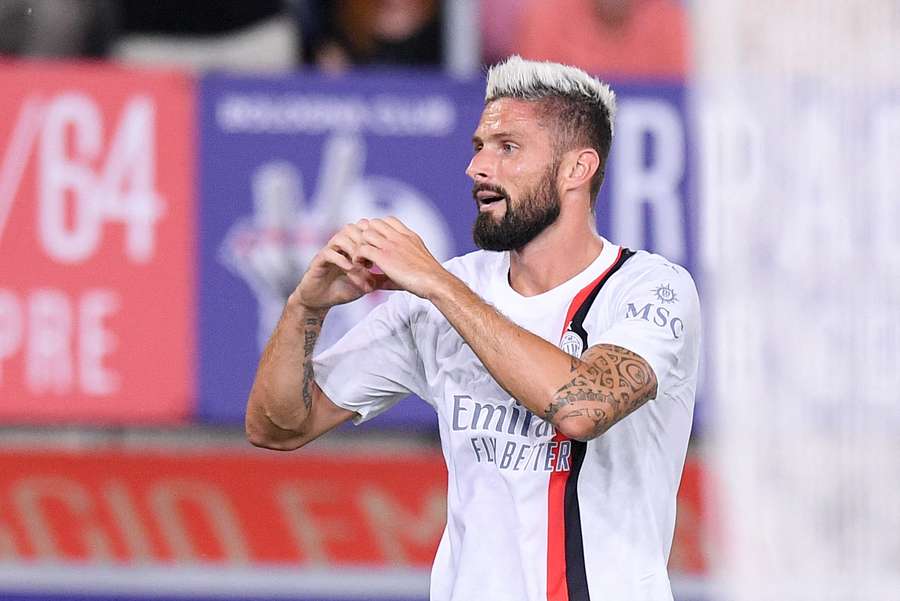 Olivier Giroud celebrates the opening goal of the game for AC Milan