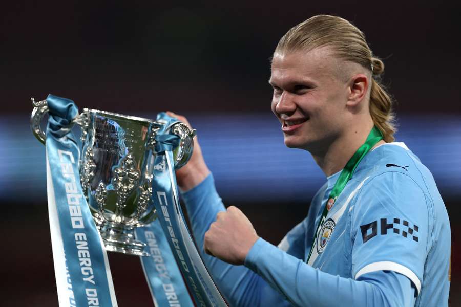 Erling Haaland with the League Cup trophy