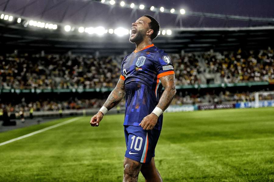 Memphis Depay celebrates scoring during the World Cup qualifying match against Lithuania