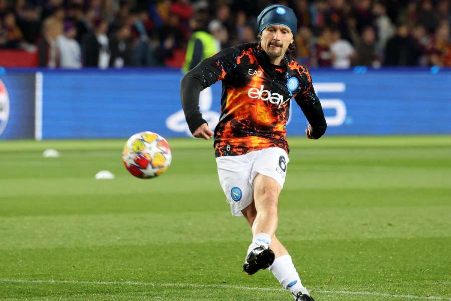 Mario Rui in action before the match 