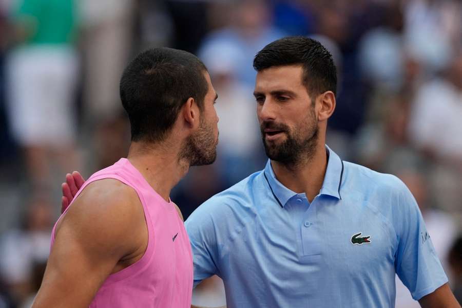 Alcaraz and Djokovic at the net