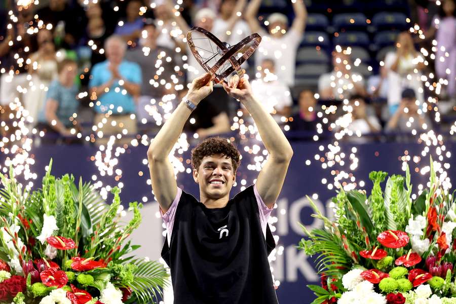 Ben Shelton lifts the trophy after winning his first ATP Masters title in Toronto.