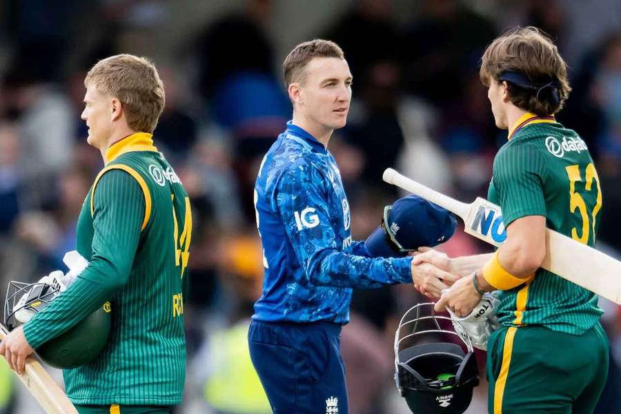 England's Harry Brook shakes hands with Dewald Brevis after his side's loss to South Africa