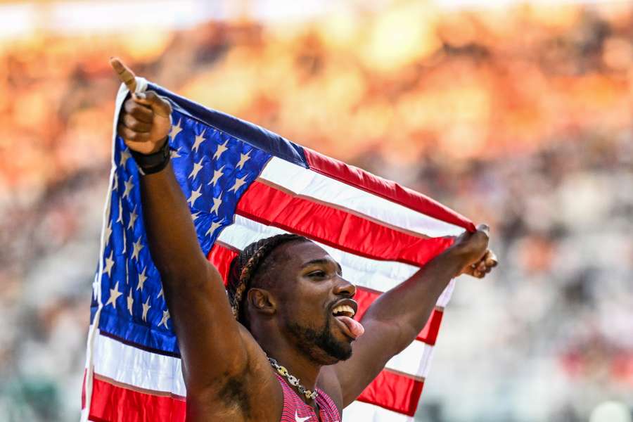 Noah Lyles celebrates after winning the men's 100m