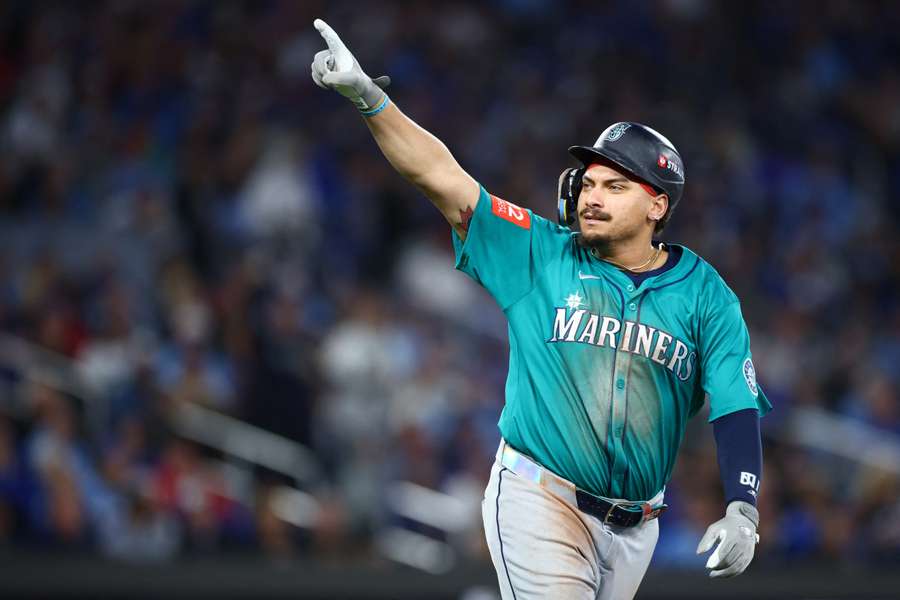 Mariners' Josh Naylor reacts to hitting a home run in Game 2 of the ALCS against the Toronto Blue Jays
