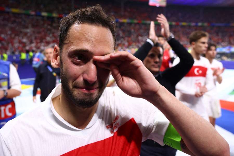 Captain Hakan Calhanoglu shows his emotion after the defeat