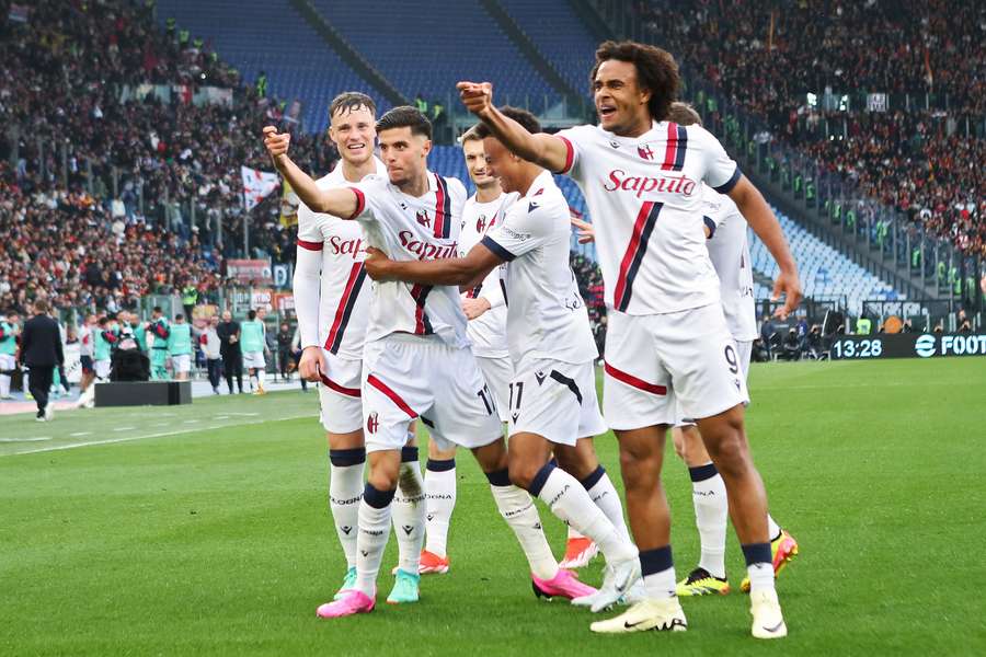 Oussama El Azzouzi of Bologna celebrates with his teammates after scoring the opening goal