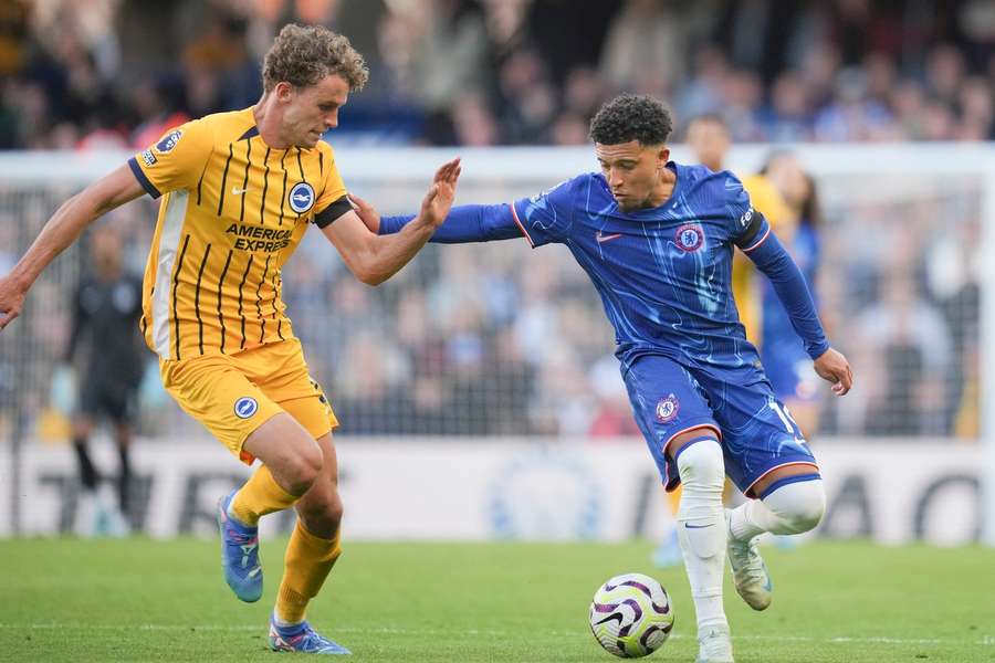 Brighton's Mats Wieffer, left, and Chelsea's Jadon Sancho vie for the ball