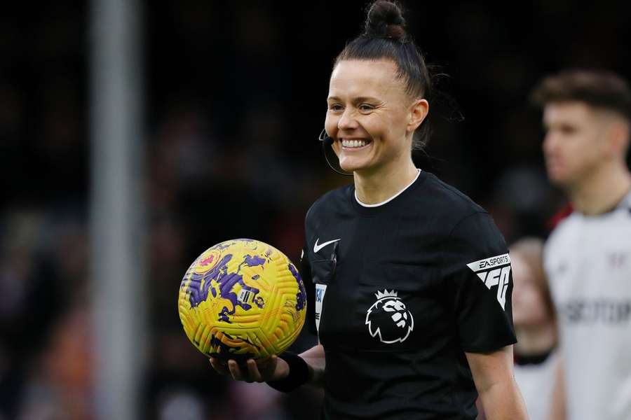 Rebecca Welch walks onto the pitch to officiate Fulham's match against Burnley