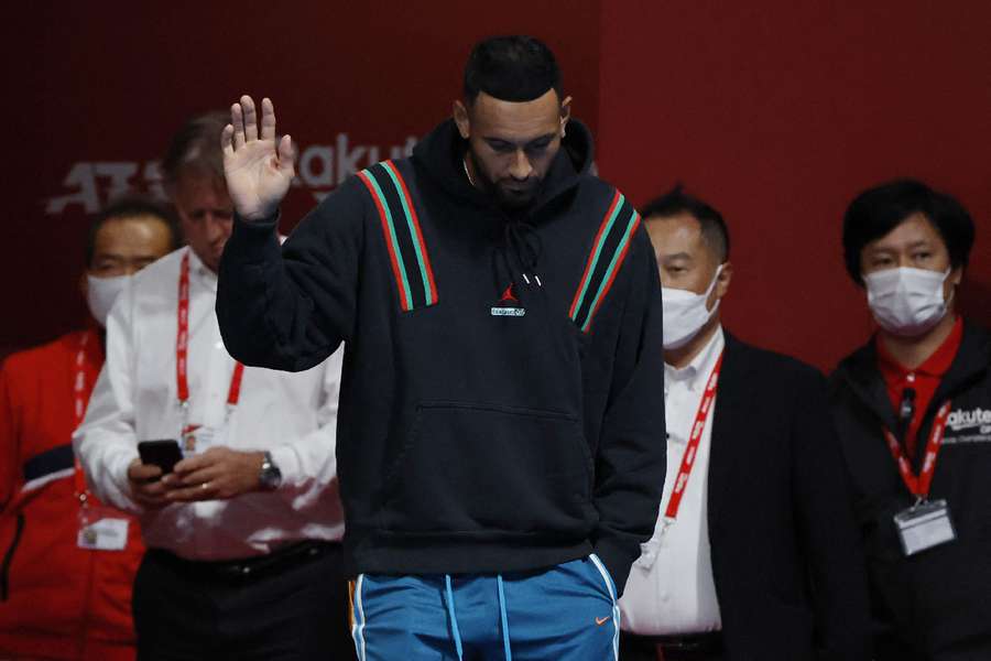 Australia's Nick Kyrgios waves to fans 