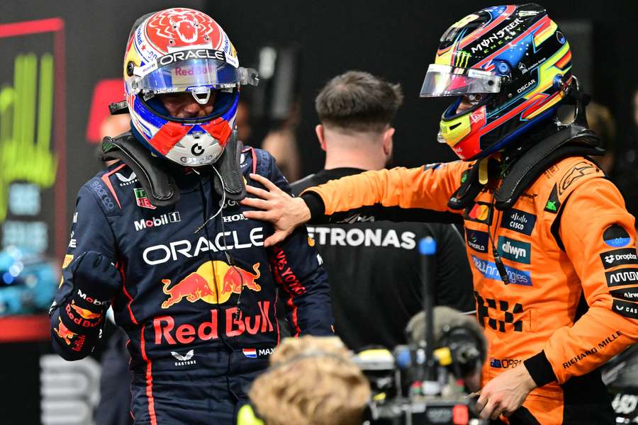 Oscar Piastri (R) congratulates Max Verstappen after clinching pole position