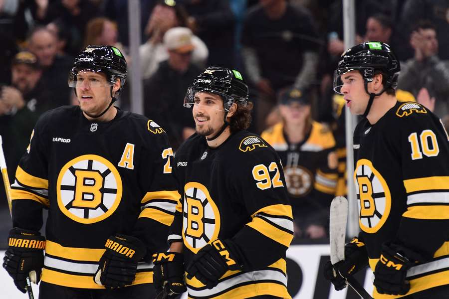 JJ Peterka, Hampus Lindholm and Marat Khusnutdinov of the Boston Bruins JJ Peterka, Hampus Lindholm and Marat Khusnutdinov of the Boston Bruins