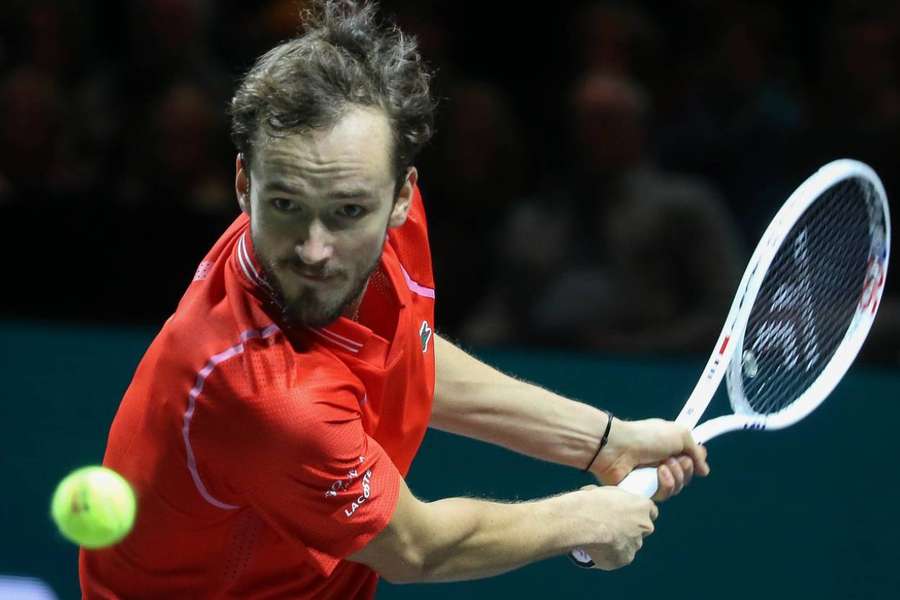 Daniil Medvedev takes a shot on his way to victory over defending champion Felix Auger-Aliassime