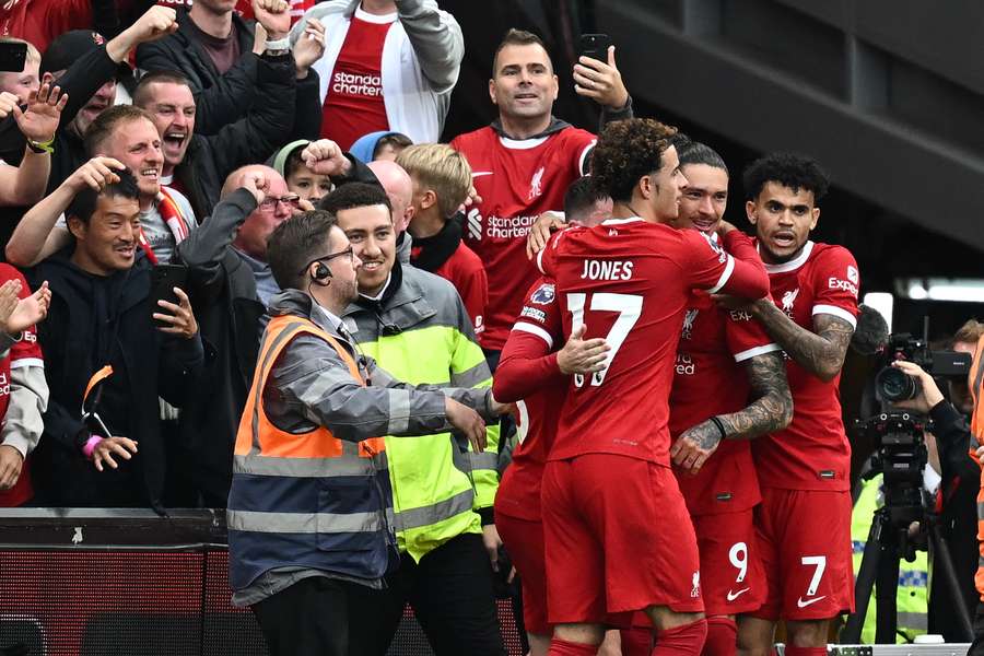 Liverpool's Uruguayan striker #09 Darwin Nunez (2R) celebrates with teammates after scoring their second goal against West Ham 