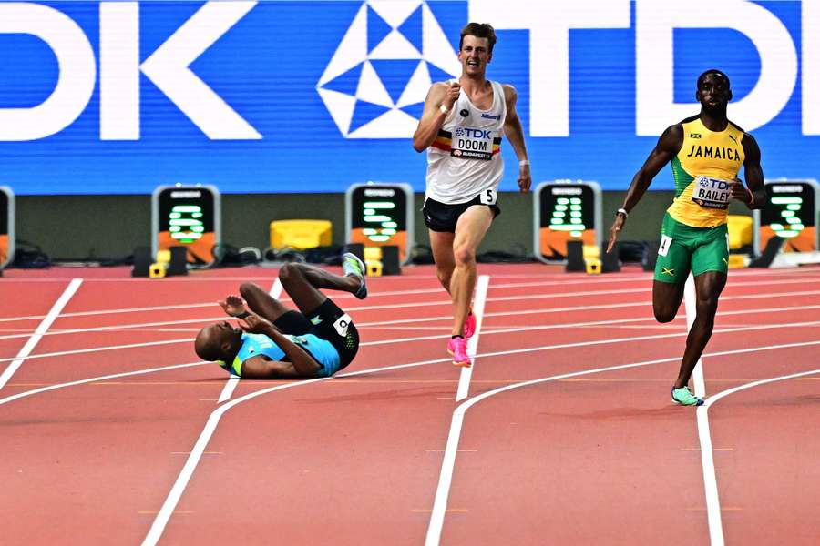 Steven Gardiner falls during the 400m semi-finals