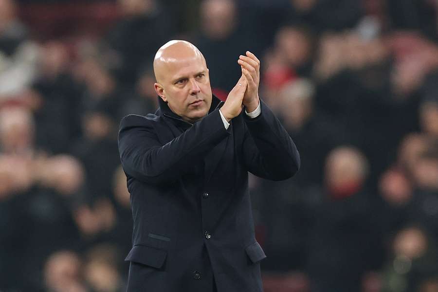 Arne Slot applauding fans after Champions League match against Lille