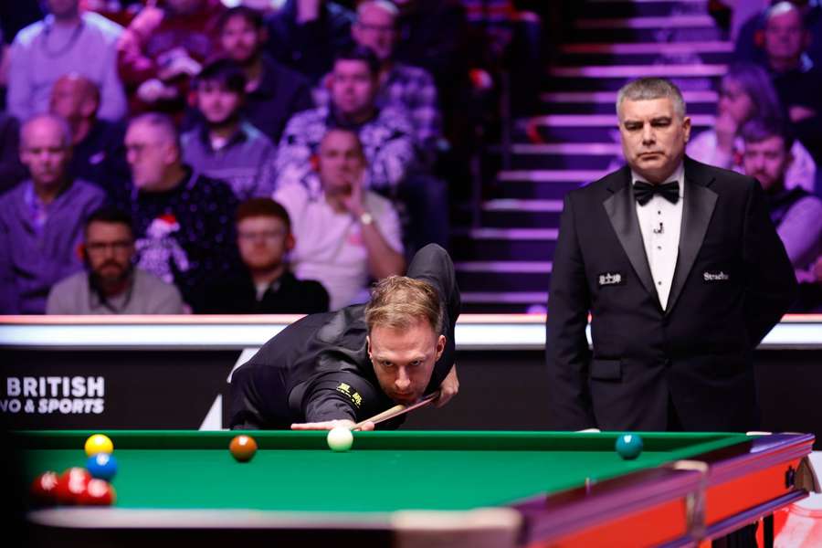 Judd Trump plays a shot in the second round match against Si Jiahui