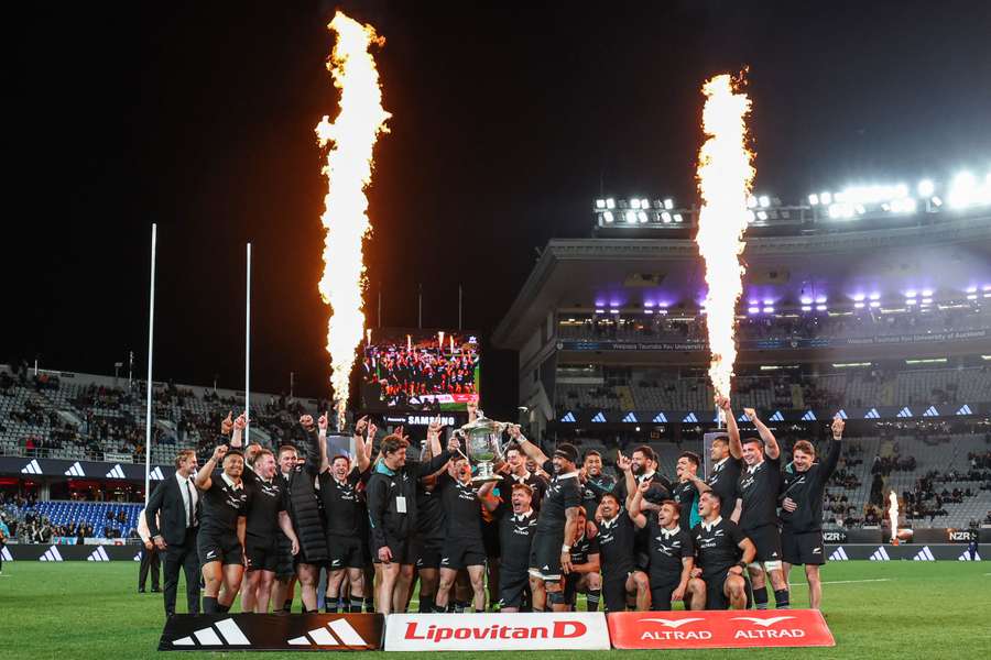 The All Blacks celebrate retaining the Bledisloe Cup with their 33-24 win over Australia at Eden Park. 