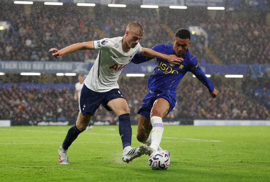 Tottenham's Jan Paul van Hecke in action with Chelsea's Morgan Rogers