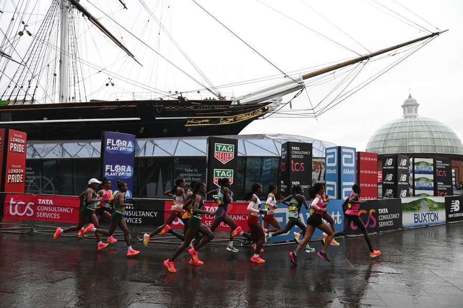 The elite women runners go past the Cutty Sark in Greenwich