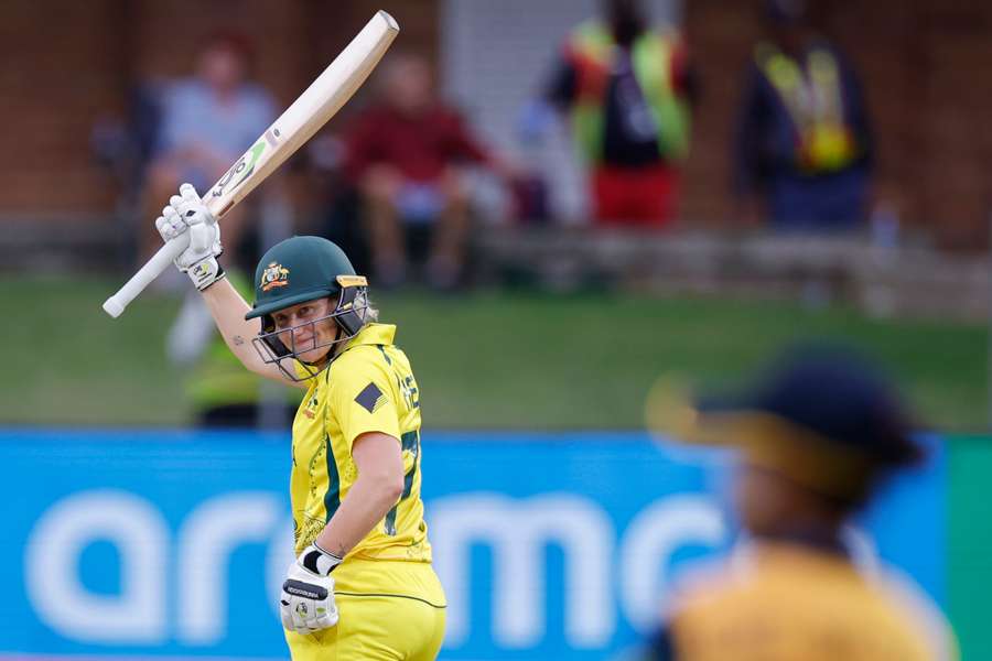 Australia's Alyssa Healy (L) celebrates after scoring a half-century
