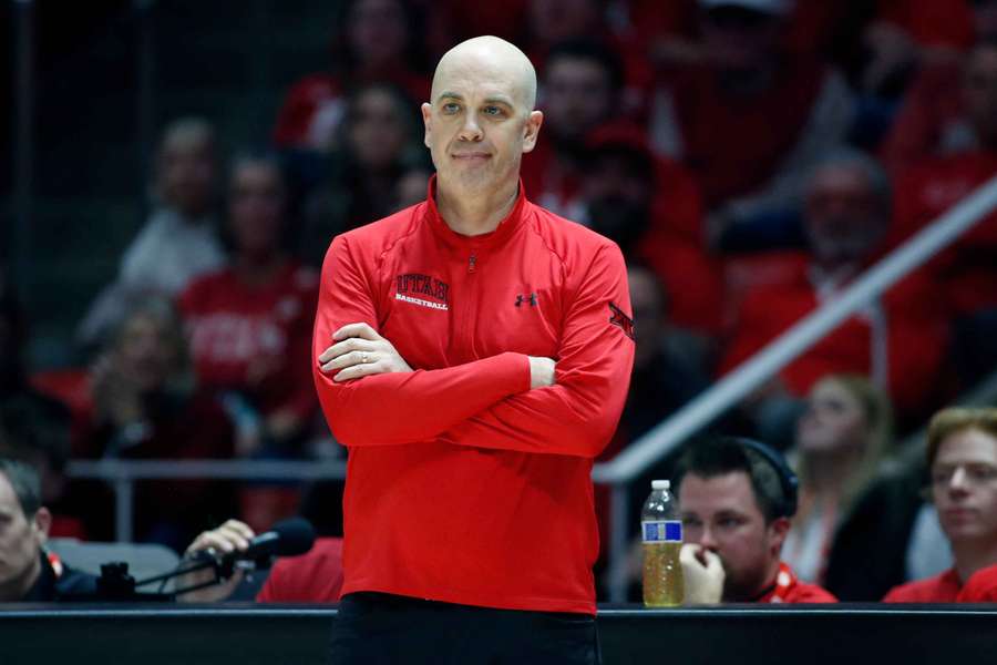 Utah men's basketball coach Craig Smith reacting to a call during their win in overtime against BYU. (2025)