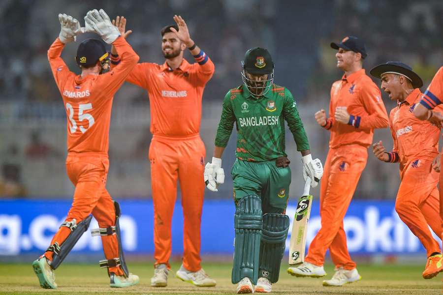 Netherlands captain and wicketkeeper Scott Edwards leads the celebration following the dismissal of Liton Das
