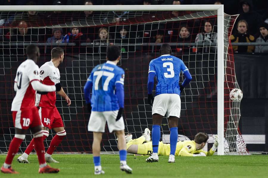 RC Genk's Zakaria El Ouahdi (#77) watches on as the ball hobbles past FC Utrecht goalkeeper Jeroen Brouwer