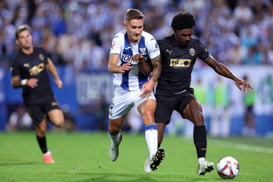 Jorge Saenz of Leganes challenges Thierry Correia of Valencia