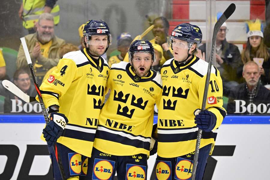 Sweden's Erik Brannstrom (centre) celebrates with Jacob Larsson (left) and Simon Holmstrom