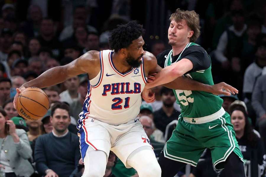 76ers Joel Embiid backs down Boston's Baylor Scheierma in Game 7