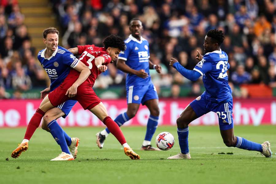 Evans (L) in action for Leicester against Liverpool