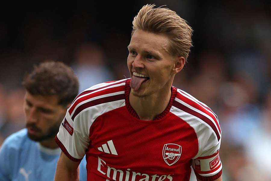 Martin Odegaard celebrates after scoring Arsenal's third goal in Cardiff Martin Odegaard celebrates after scoring Arsenal's third goal in Cardiff