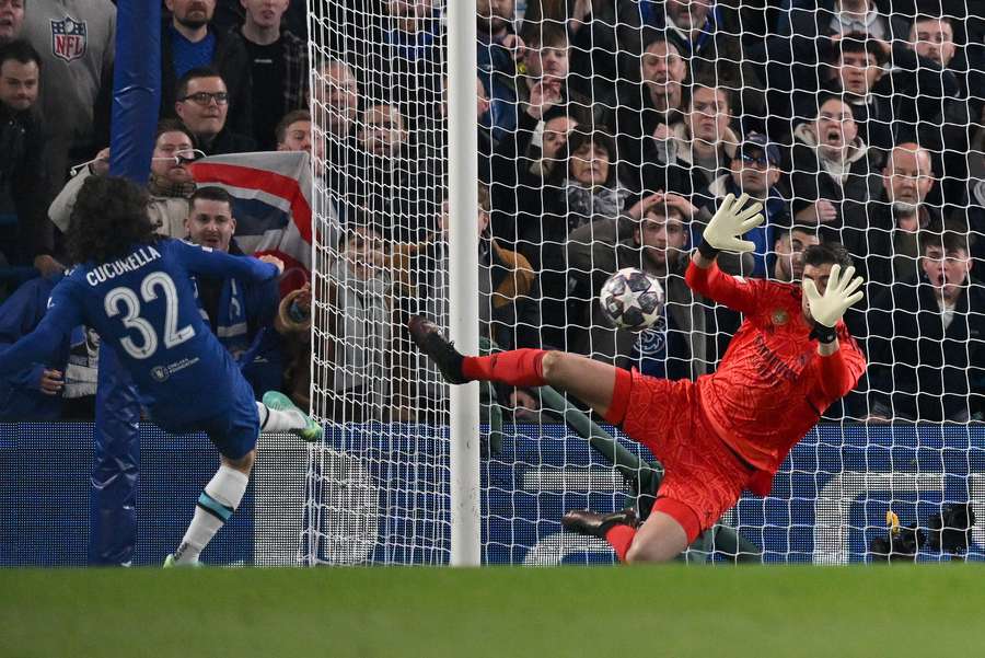 Real Madrid's Belgian goalkeeper Thibaut Courtois saves a shot from Chelsea's Spanish defender Marc Cucurella Real Madrid's Belgian goalkeeper Thibaut Courtois saves a shot from Chelsea's Spanish defender Marc Cucurella