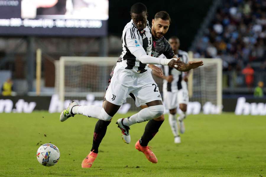 Timothy Weah in action with Empoli's Giuseppe Pezzella