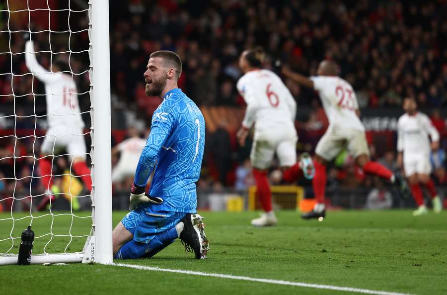 Manchester United's Spanish goalkeeper David de Gea reacts after conceding a second goal during the UEFA Europa league quarter-final, first leg football match between Manchester United and Sevilla at Old Trafford stadium in Manchester, north west England, on April 13, 2023